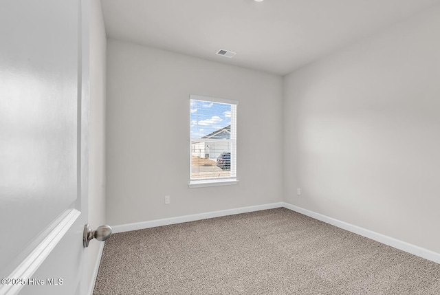 view of carpeted spare room