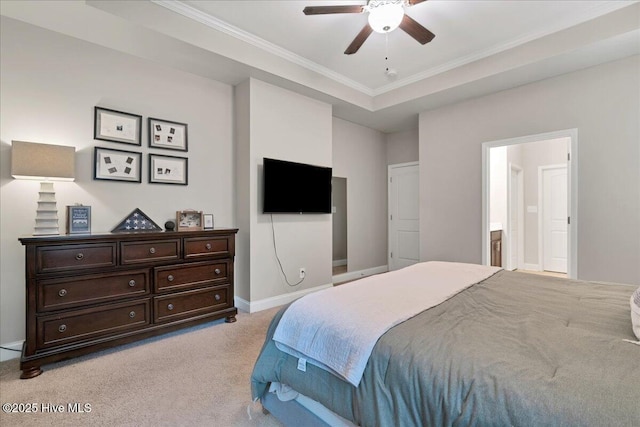 bedroom with baseboards, a ceiling fan, connected bathroom, light colored carpet, and crown molding