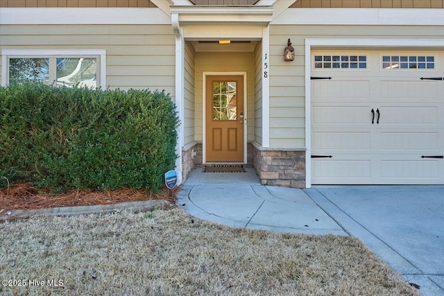 property entrance featuring stone siding