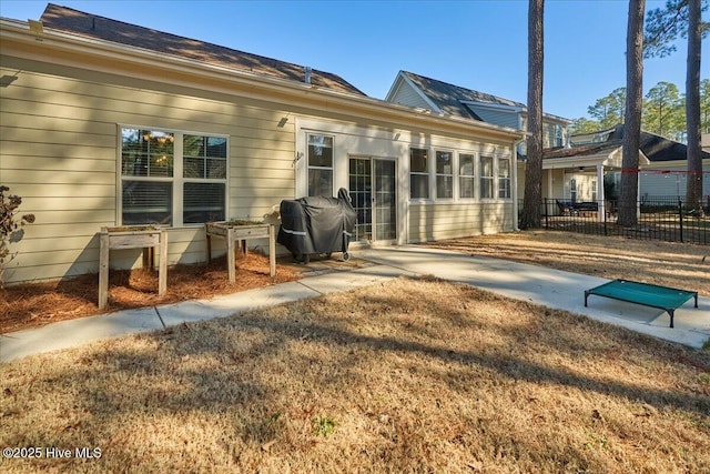 rear view of house with fence