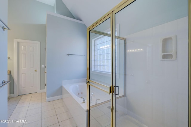 full bath featuring tile patterned flooring, a garden tub, baseboards, vaulted ceiling, and a shower stall