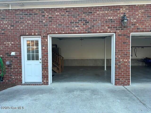 garage with concrete driveway