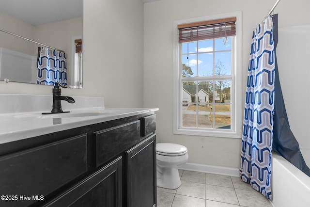 full bathroom with vanity, shower / tub combo, tile patterned flooring, and toilet