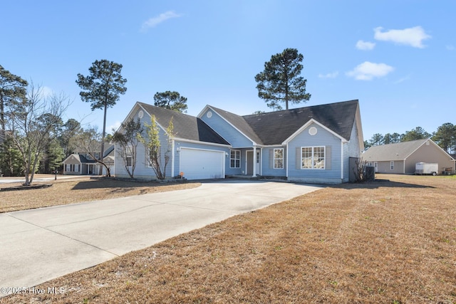 view of front facade with a garage and a front lawn