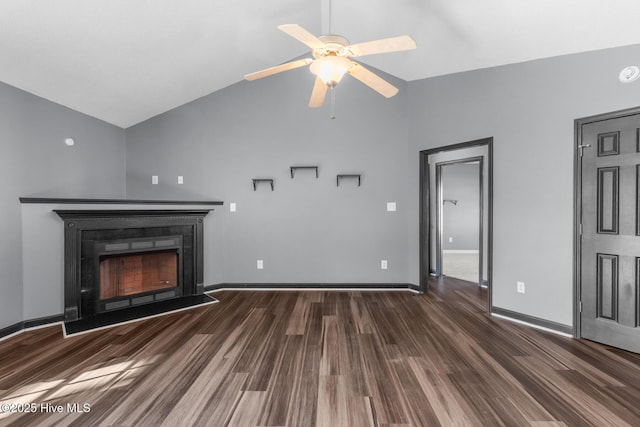 unfurnished living room featuring lofted ceiling, dark hardwood / wood-style floors, and ceiling fan