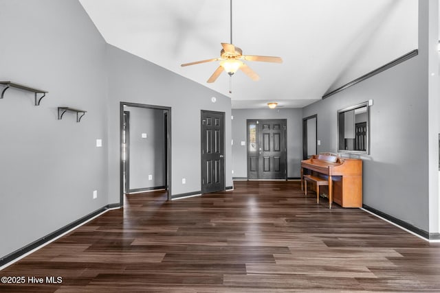 interior space featuring dark hardwood / wood-style flooring, high vaulted ceiling, and ceiling fan