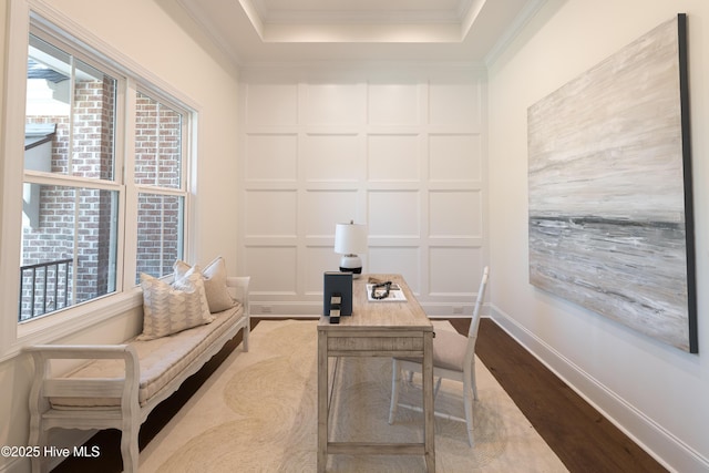 office featuring ornamental molding and light hardwood / wood-style flooring