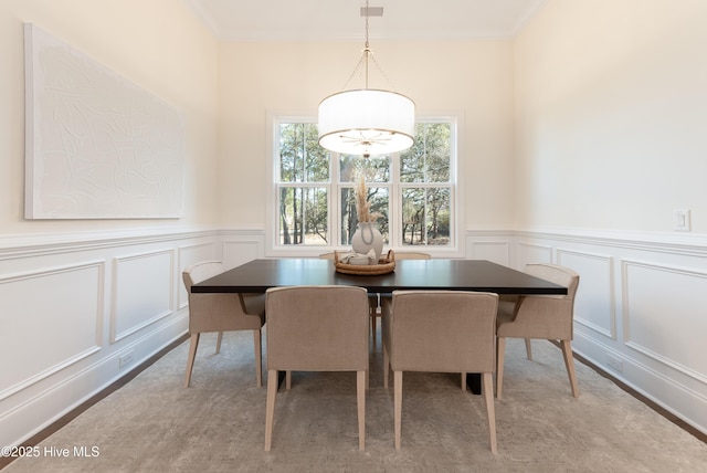 dining area featuring ornamental molding