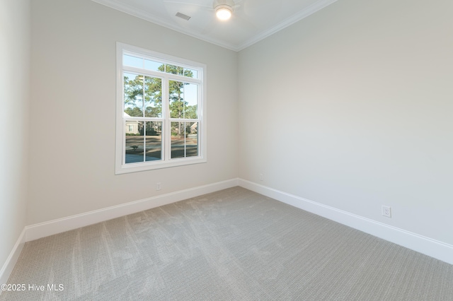 carpeted empty room featuring ornamental molding