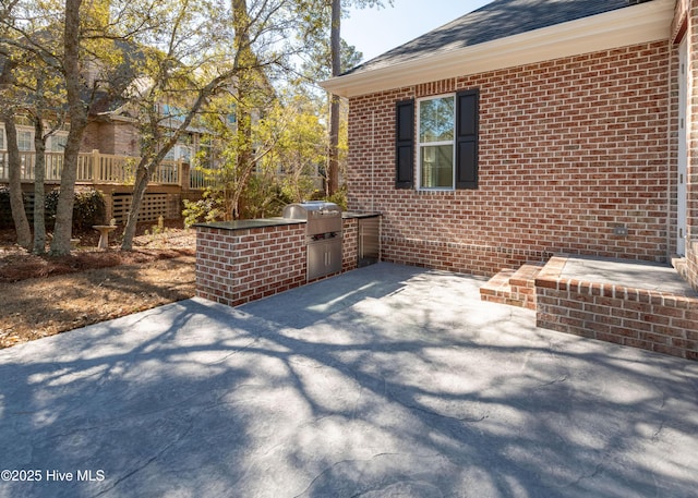 view of patio with exterior kitchen and area for grilling