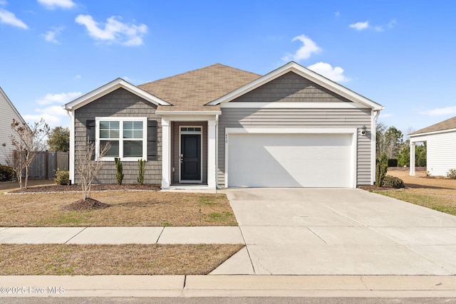 single story home featuring driveway and an attached garage