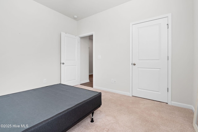 bedroom with carpet and baseboards