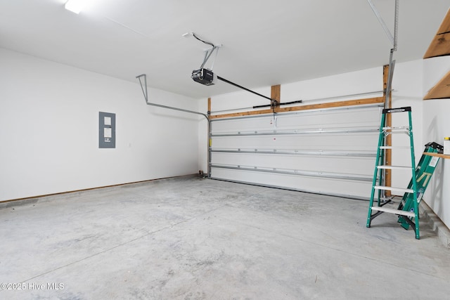 garage with a garage door opener and electric panel