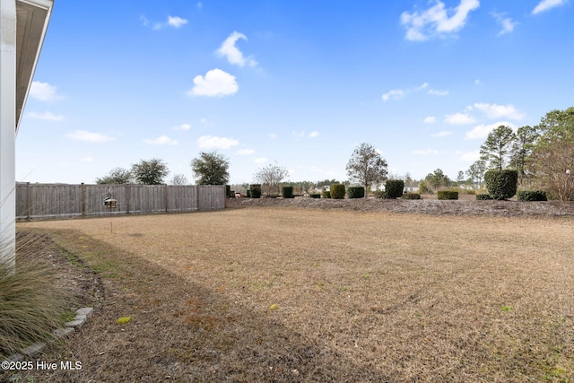 view of yard with fence