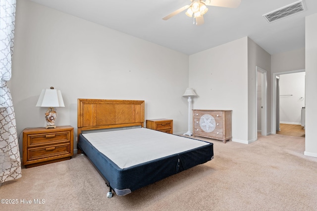 bedroom featuring carpet floors, baseboards, visible vents, and a ceiling fan