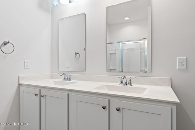 full bath featuring double vanity and a sink