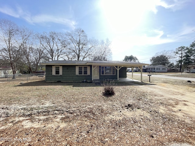 ranch-style house with a carport