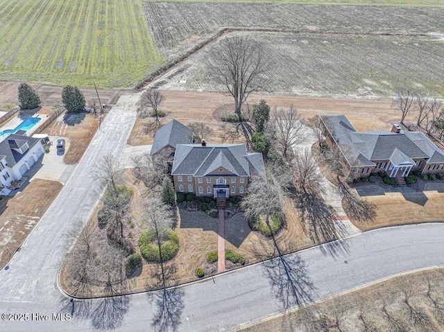 birds eye view of property with a rural view