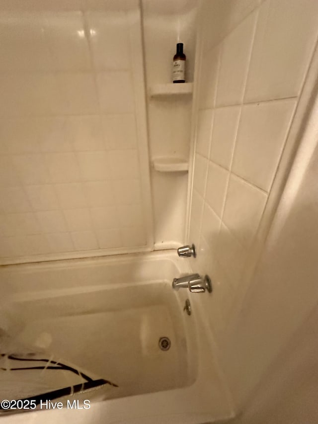 bathroom with shower / bathtub combination