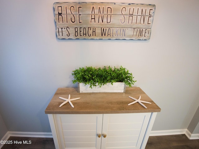 interior details with wood finished floors and baseboards