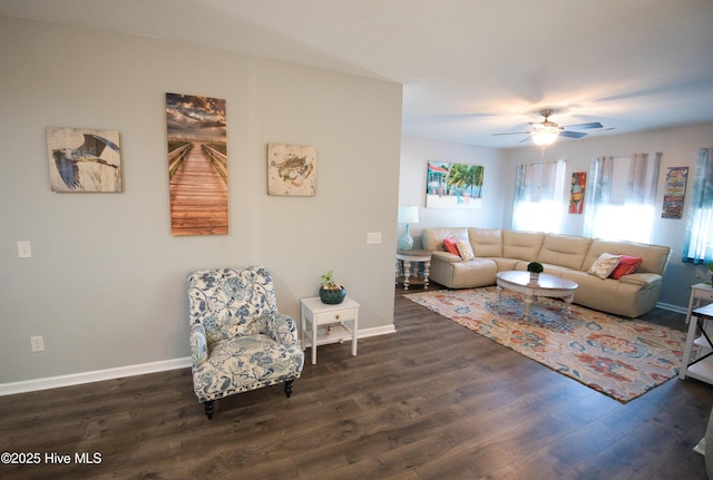 living area featuring dark wood-style floors and baseboards