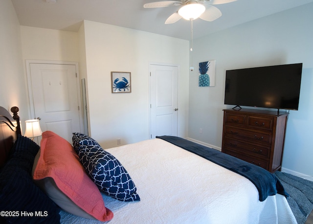 bedroom with a ceiling fan and baseboards