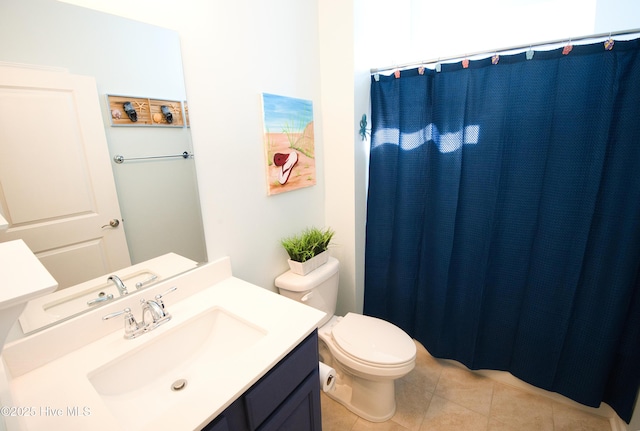 full bathroom with curtained shower, tile patterned flooring, vanity, and toilet