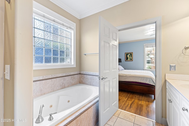 ensuite bathroom with ornamental molding, plenty of natural light, connected bathroom, and tile patterned floors