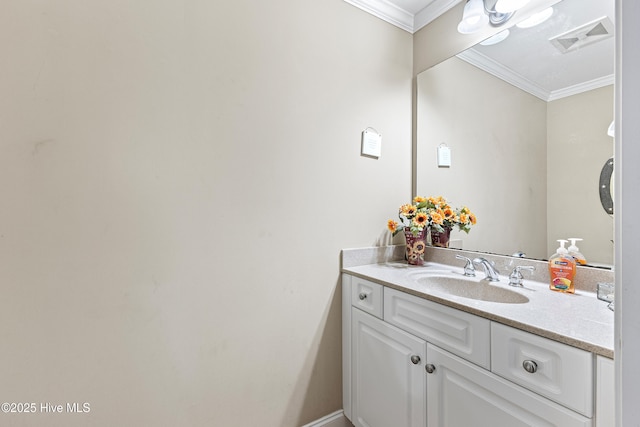 bathroom with ornamental molding, visible vents, and vanity