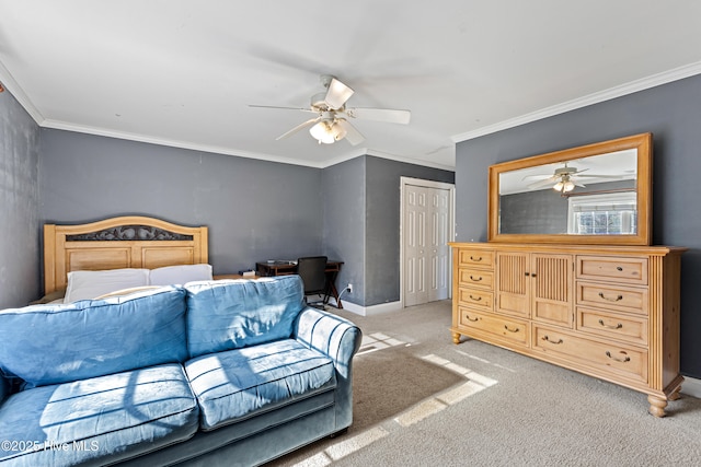 bedroom with ornamental molding, a closet, light carpet, and baseboards