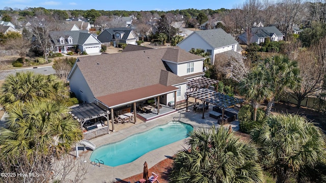 birds eye view of property with a residential view