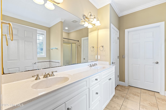 bathroom featuring crown molding, a stall shower, a sink, and tile patterned floors