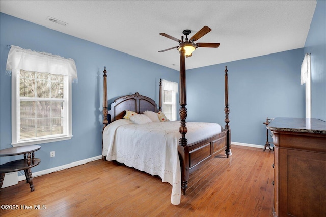 bedroom featuring ceiling fan and wood-type flooring