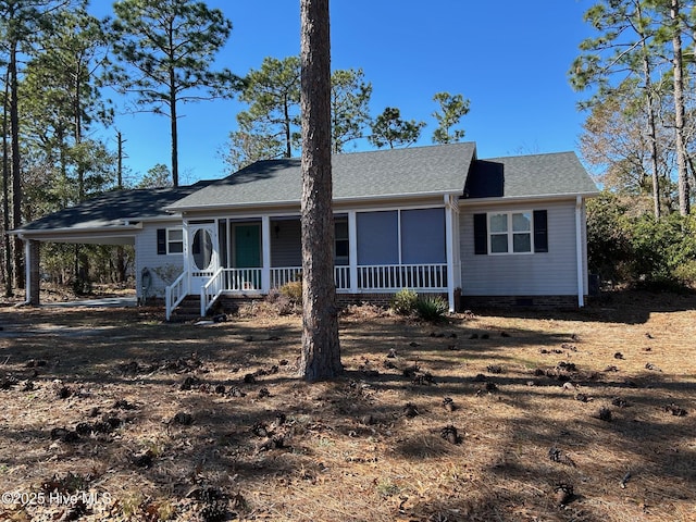 view of front of home featuring a carport