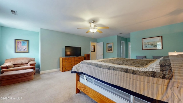 bedroom with light colored carpet and ceiling fan