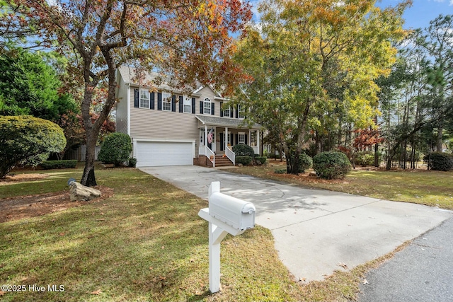 view of front of home with a garage and a front yard