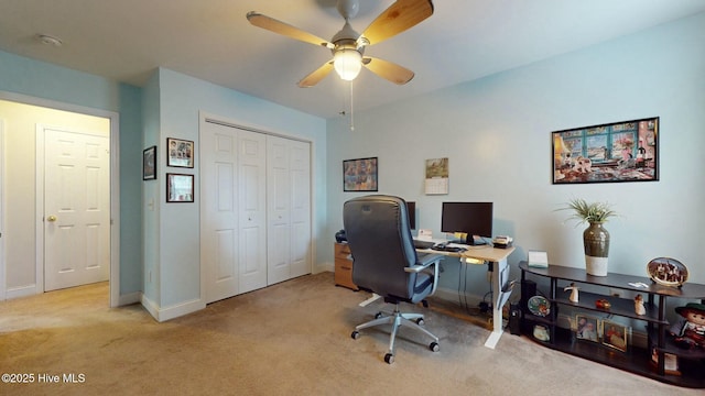 home office featuring light colored carpet and ceiling fan