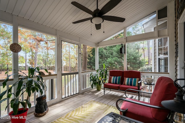 sunroom featuring vaulted ceiling, ceiling fan, and wood ceiling