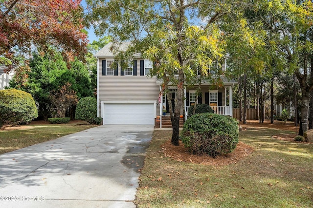 view of front of property with a garage, a porch, and a front lawn