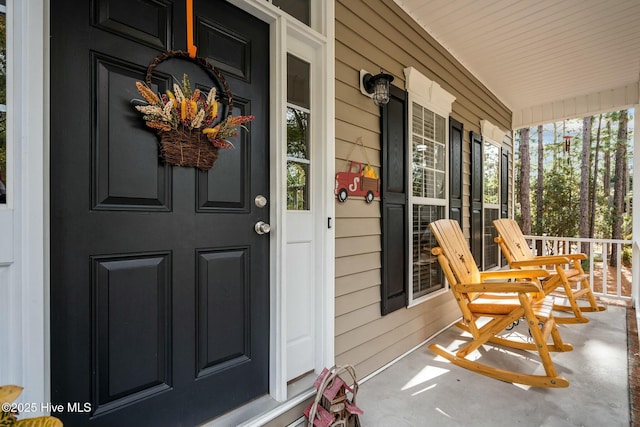 doorway to property featuring a porch