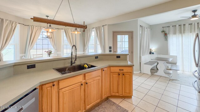 dining area with a wealth of natural light, an inviting chandelier, and light tile patterned floors