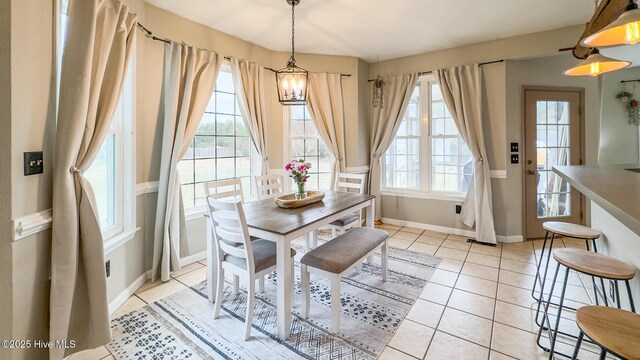 dining room with visible vents, baseboards, and light tile patterned floors