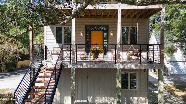 view of front of property featuring stairway