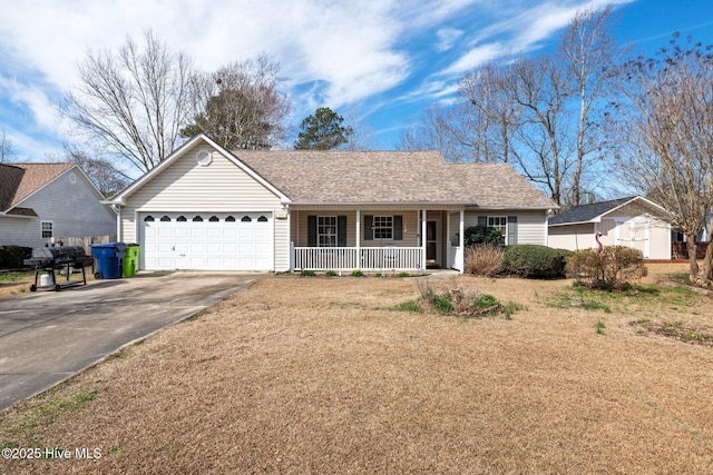 single story home featuring covered porch, a garage, and a front lawn