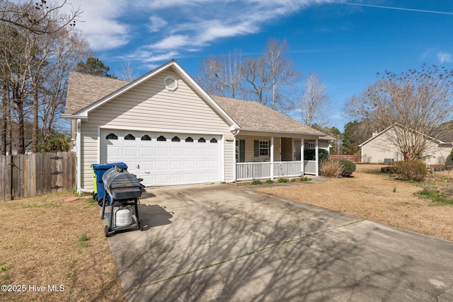 ranch-style home featuring a front yard, a garage, and a porch