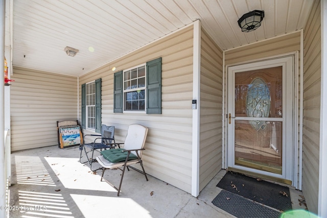 property entrance with covered porch