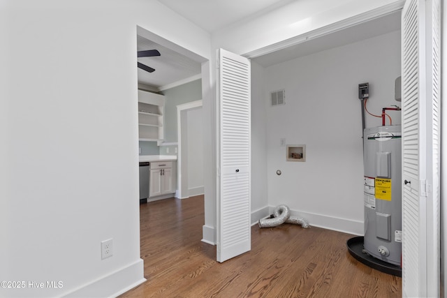 laundry room with hookup for a washing machine, water heater, visible vents, wood finished floors, and baseboards