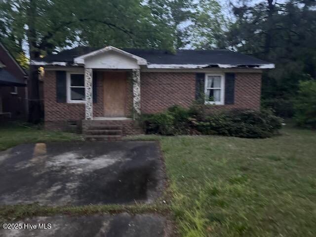 617 Myrtle Ave, Rocky Mount, NC 27801 - ranch-style house with a front lawn and brick siding