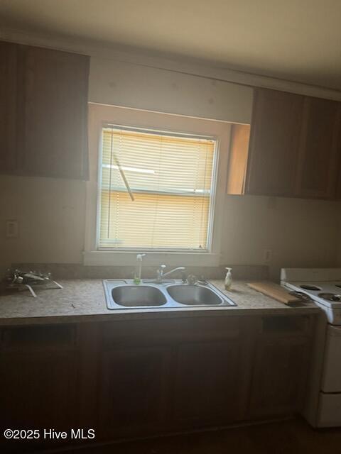 617 Myrtle Ave, Rocky Mount, NC 27801 - kitchen with light countertops, a sink, and white electric stove
