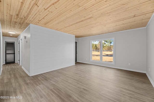 unfurnished room featuring ornamental molding, wood finished floors, wood ceiling, and baseboards